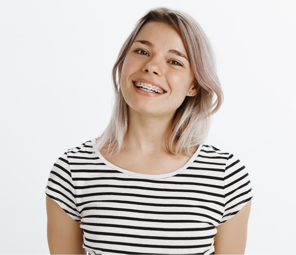 young patient smiling wearing braces