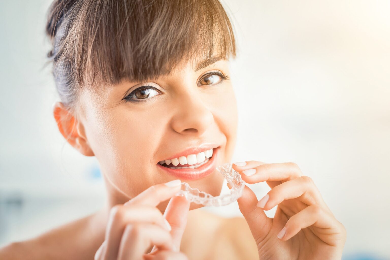 Invisalign clear aligners for a smiling patient in Dallas Invisalign Dallas